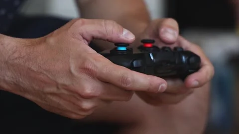 Man playing video game on gamepad. Video stock 252323616