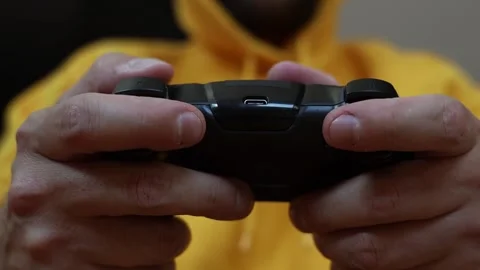 Man playing video game on gamepad. Video stock 252324005