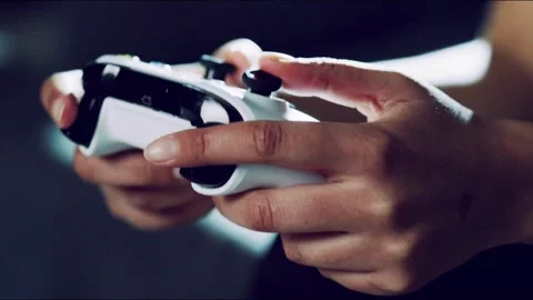 A man playing a video game with a joystick. Close up of children's hands Vídeos de archivo 334653762