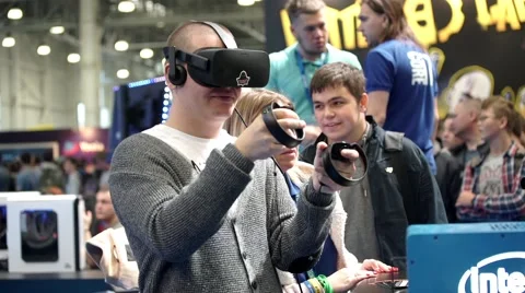 Man playing video game with Oculus Development Kit VR glasses 스톡 동영상 68801591