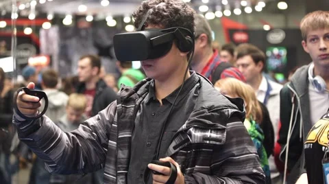 Man playing video game with Oculus Development Kit VR glasses Stock Footage 68830043