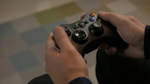 Man playing a video game using a game controller. Console Video Game. Stock Footage 69819192