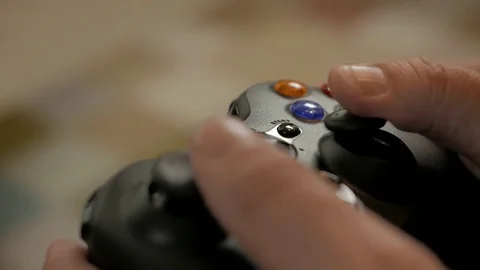 Man playing a video game using a game controller. Console Video Game. Video stock 69819692