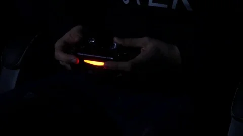 Man playing with a videogame controller in his hands Video stock 84761833