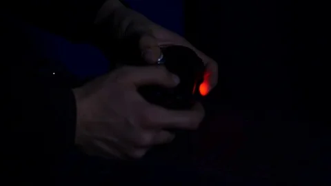 Man playing with a videogame controller in his hands Stock Footage 84761875