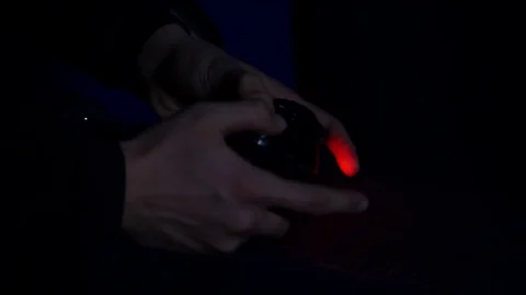 Man playing with a videogame controller in his hands Stock Footage 84954410