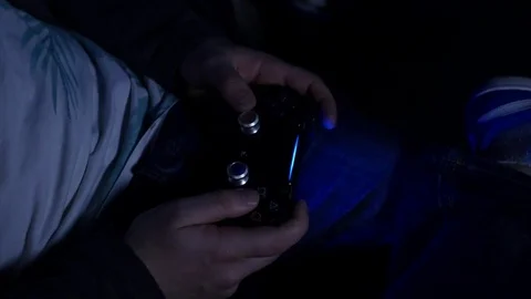 Man playing with a videogame controller in his hands Stock Footage 85064765