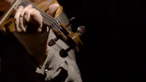 Man playing the viola in slow motion with black background Stock Footage 108371390