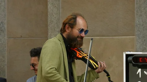 Man playing a violin and posing for selfie in Munich Stock Footage 54194405