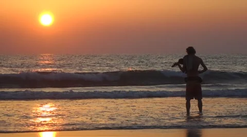 Man is playing violin at the Arambol beach Stock Footage