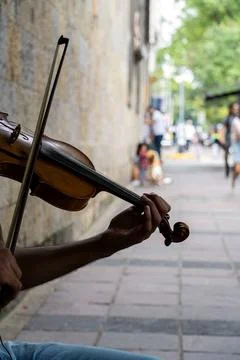 Man playing the violin. Musical theme. male fingers grip the strings and ho.. Stock Photos