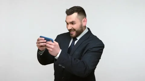 Man playing virtual games on smart phone during break. Stock Footage 159625578