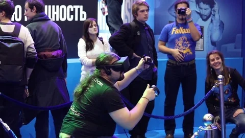 Man playing virtual reality game in VR headset with accessories controllers on Stock Footage 81513968