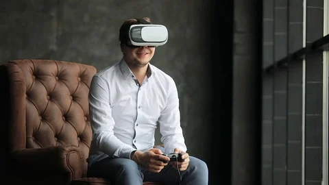 Man playing in Virtual Reality Glasses Video stock 74532986