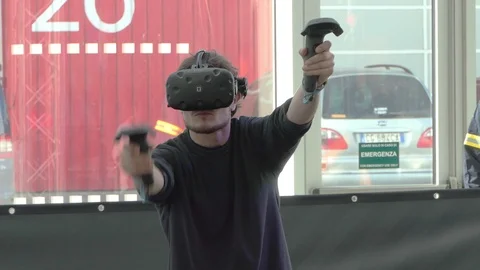Man playing with virtual reality glasses and joysticks Stock-Footage 104098923