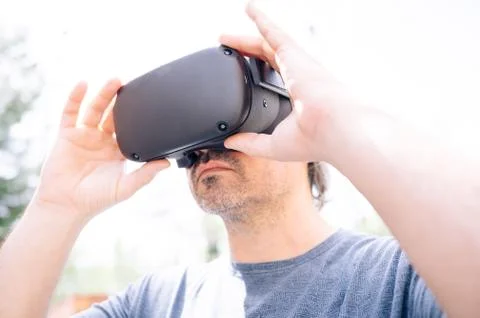Man playing with virtual reality goggles. Stock Photos