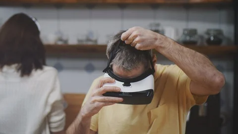Man playing in vr helmet in kitchen Stock Footage 104607622