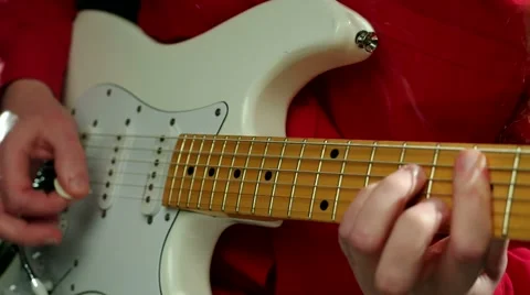 Man Playing on white electric guitar Stock Footage 60122280