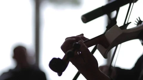 Man is playing on a white violin. 動画素材 73445285