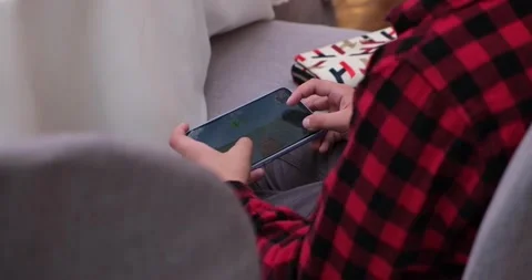 A man plays an application on the phone. Close-up screen Stock Footage 221486822