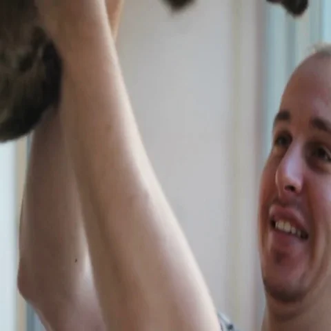 Man plays with a beautiful gray cat Video stock 69435463
