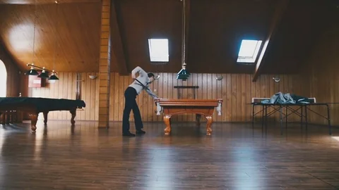 Man plays billiards Stock Footage 81543954