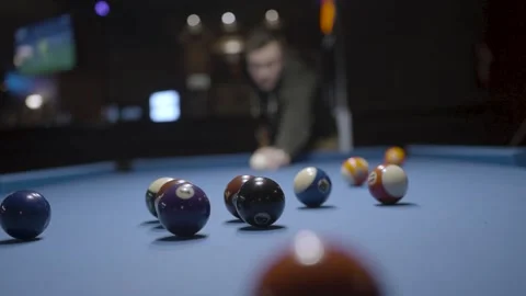 A man plays billiards Stock Footage 309894873