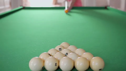Man plays billiards, rack focus Stock Footage 153464499