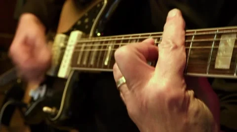 Man Plays Chords on Guitar Stock Footage 49654579