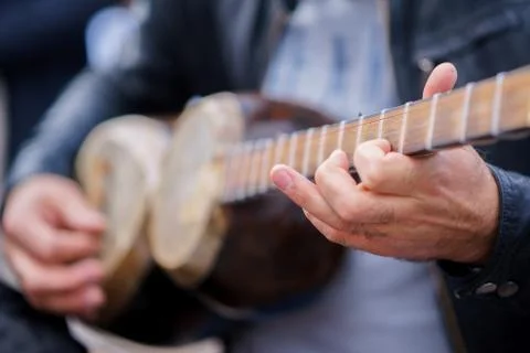 A man plays on a classical folk instrument tar of Azerbaijan Stock Photos