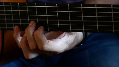 Man plays on the classical guitar close up footage Stock Footage 111957326