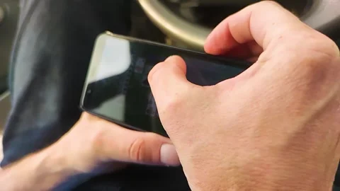 A Man Plays a Computer Game on a Smartphone.  Stock Footage 247164275