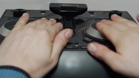 The man plays on the DJ console. Stock Footage 146513133