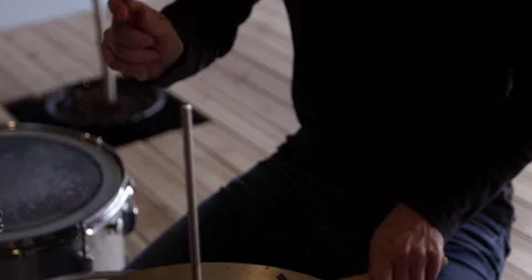 Man plays drums - close up on sticks hitting cymbals Stock Footage 148245972