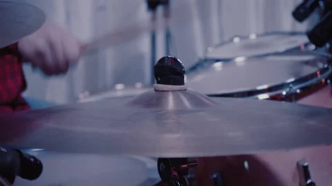 The man plays the drums vigorously Stock Footage 130750904