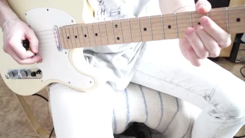 Man plays the electric guitar close up Stock Footage