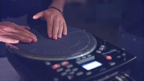 A man plays the electronic drum. Close-up. A man is moving nearby Stock Footage 129043389