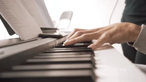 A man plays an electronic piano Stock Footage 131567043