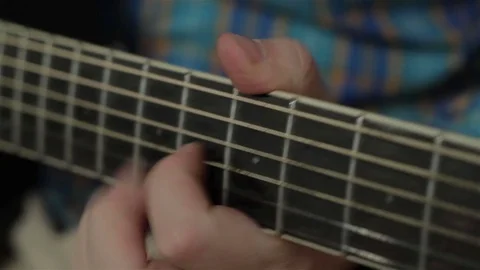 Man plays a guitar. Close-up Video stock 72721622