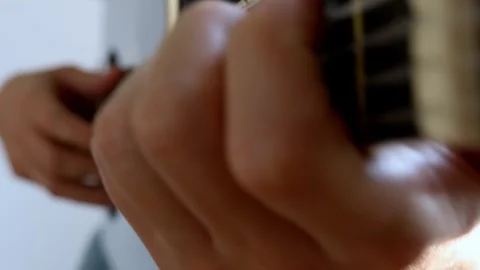 The man plays the guitar. Close-up. Video stock 244877758