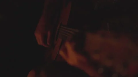 Man Plays Guitar By Fire Light Stock Footage 208717995
