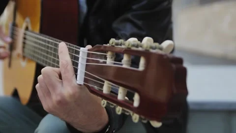 Man plays the guitar Stock Footage 132960768