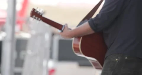 Man plays Guitar on outdoor stage Stock Footage 166326863