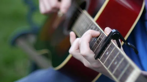 Man Plays Guitar in The Park Stock Footage 37057548