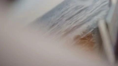 A man plays the guitar while sitting by the sea. Close up Vídeo Stock 64901403