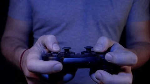 Man plays a joystick in a game console, hands close-up Stock Footage 231202610