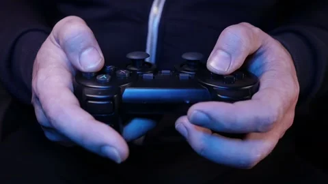 Man plays a joystick in a game console, hands close-up Stock Footage 231202630