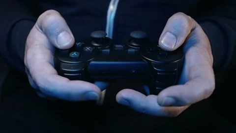 Man plays a joystick in a game console, hands close-up Stock Footage 231202636