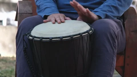 A man plays a long drum at a party. Thai musical instruments Stock Footage 259127464