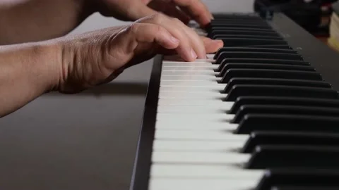 Man plays a Midi keyboard, large space for text Stock Footage 222925231